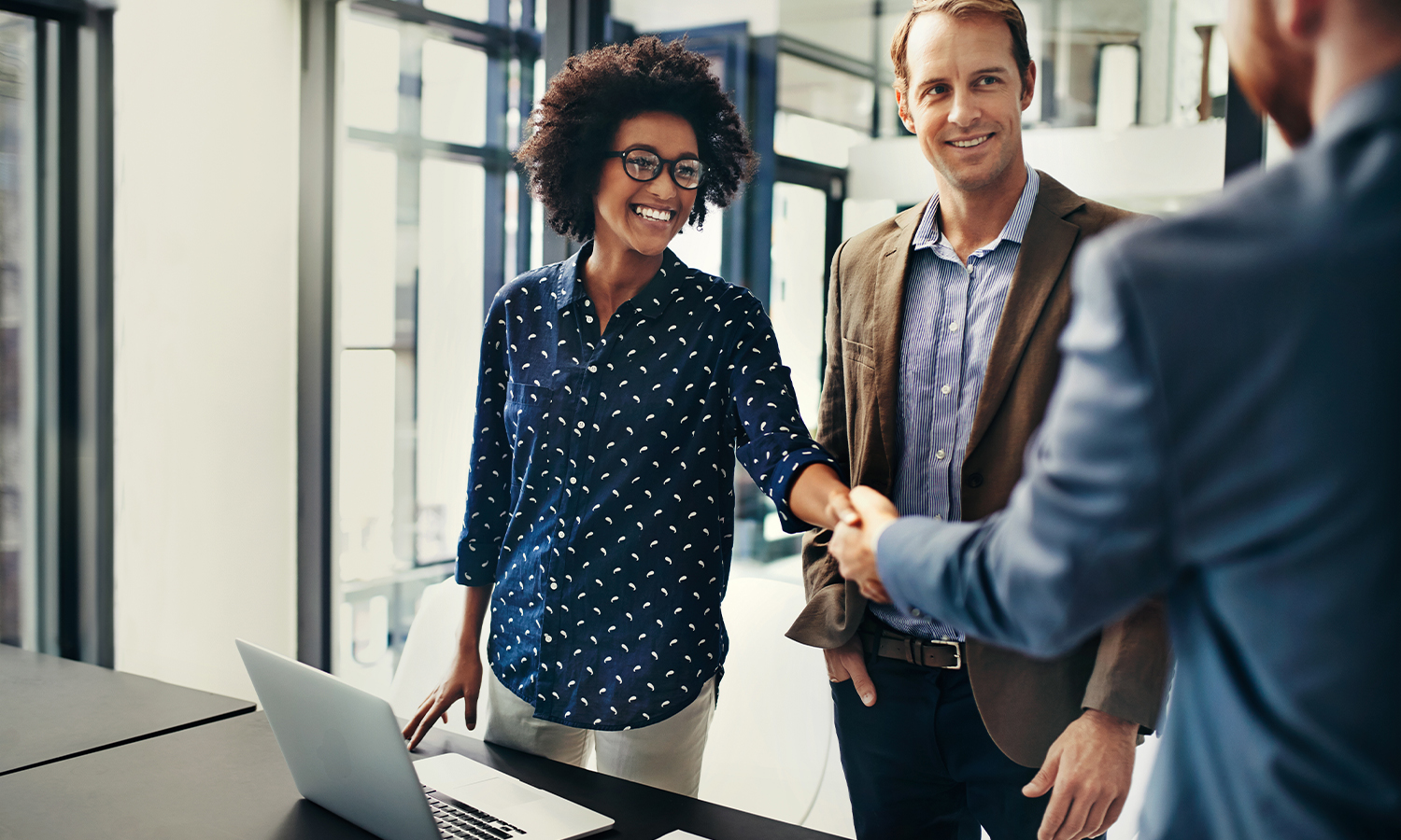 GoTo Connect - Mainstay Underwriting Case Study header of people in office