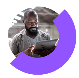 Person in factory using remote access and support tools on a tablet.